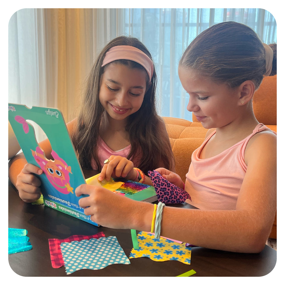 Children creating and playing with a DazziL activity kit
