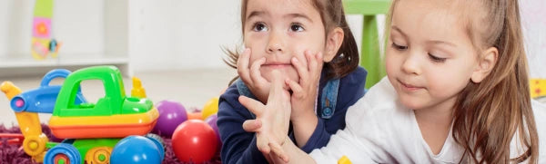 Children playing together with toys